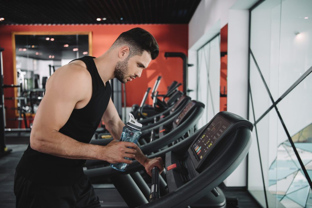 person watching the control panel of the treadmill